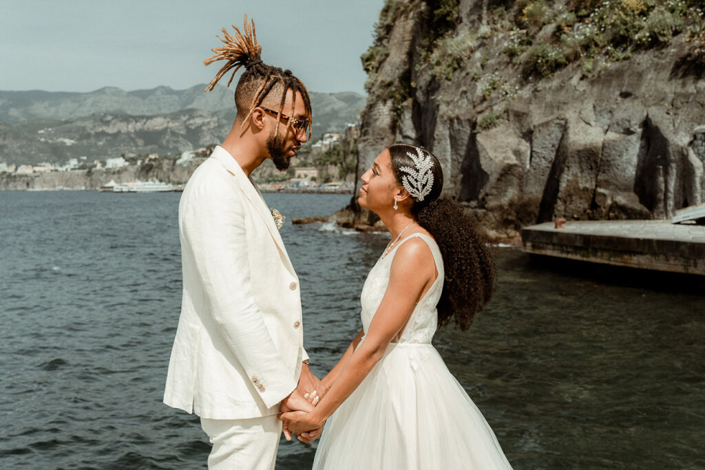 Best locations for an adventure elopement in Italy 18 Elopement in Sorrento Italy: couple holding hands in Marina Grande Sorrento